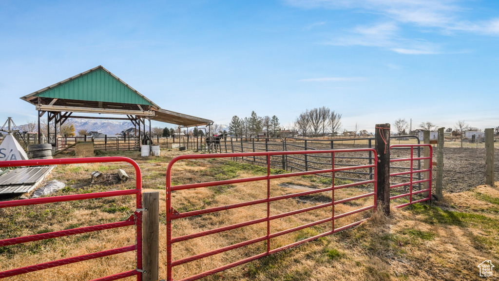 View of gate with a rural view