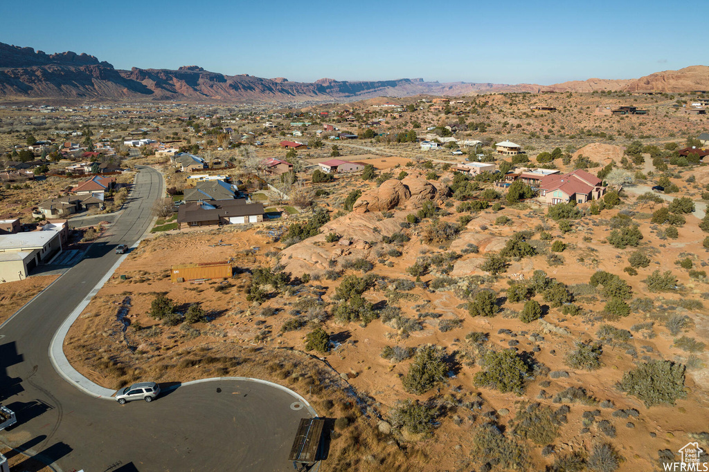 Birds eye view of property with a mountain view