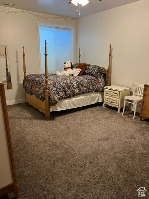 Bedroom featuring carpet and ceiling fan