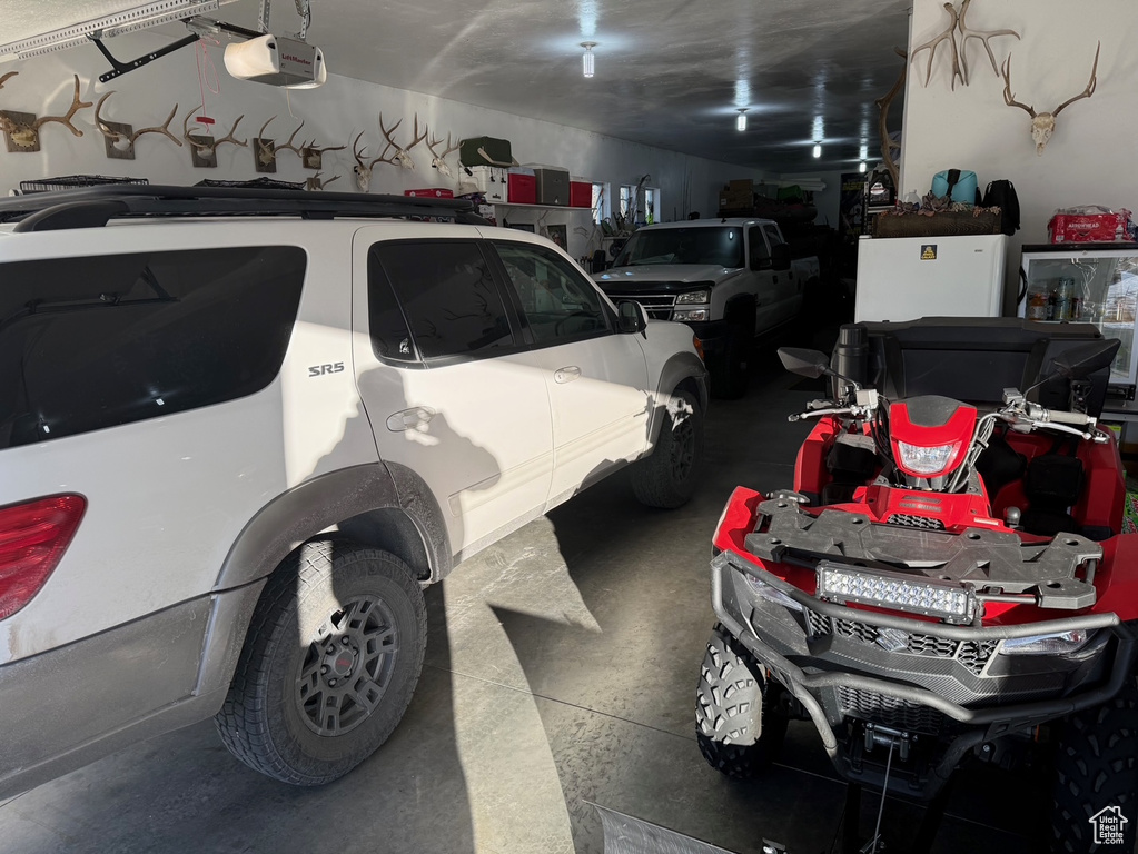Garage featuring a garage door opener