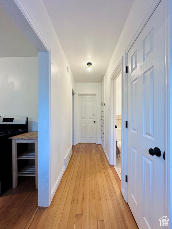 Corridor featuring light hardwood / wood-style flooring