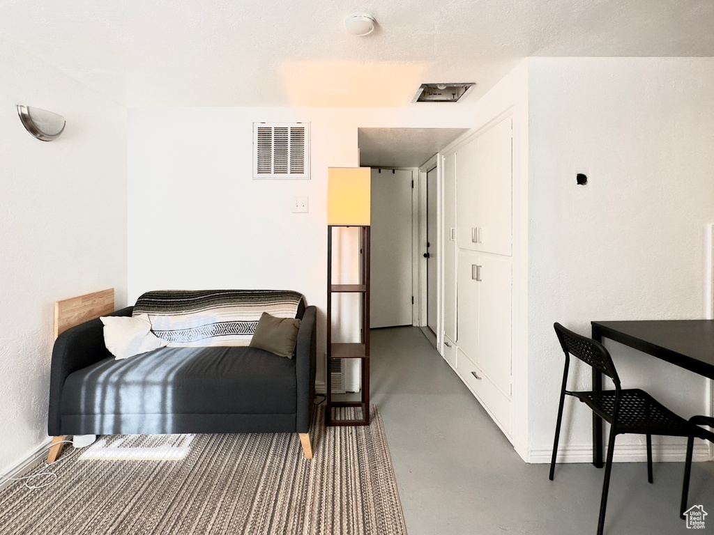 Bedroom featuring concrete flooring