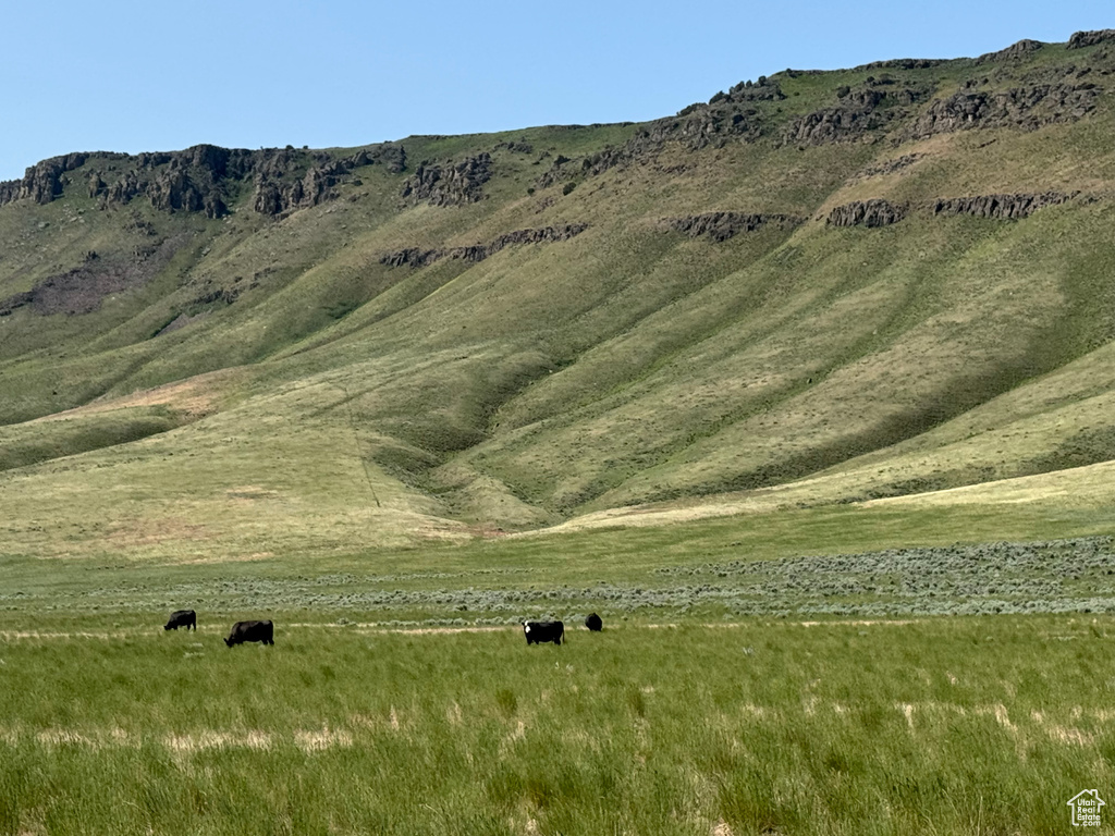 View of mountain background featuring rural landscape