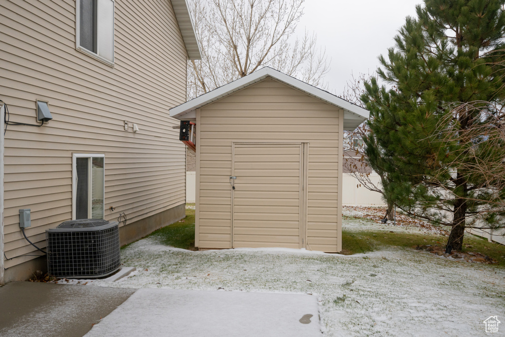 View of outdoor structure with central AC unit