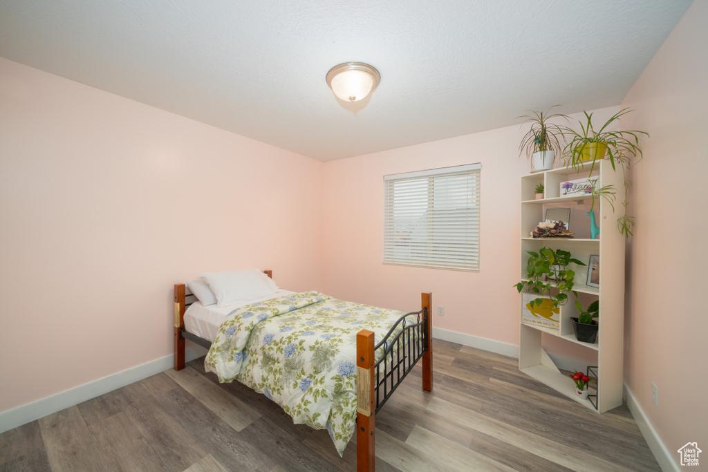 Bedroom featuring wood-type flooring