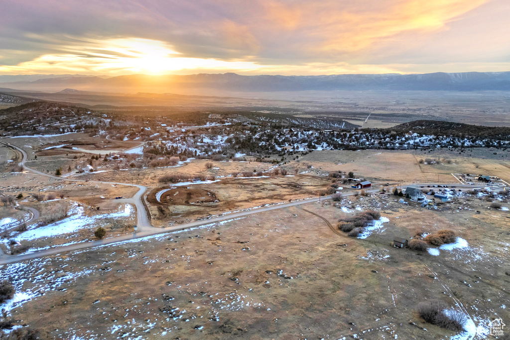 Snowy aerial view featuring a mountain view