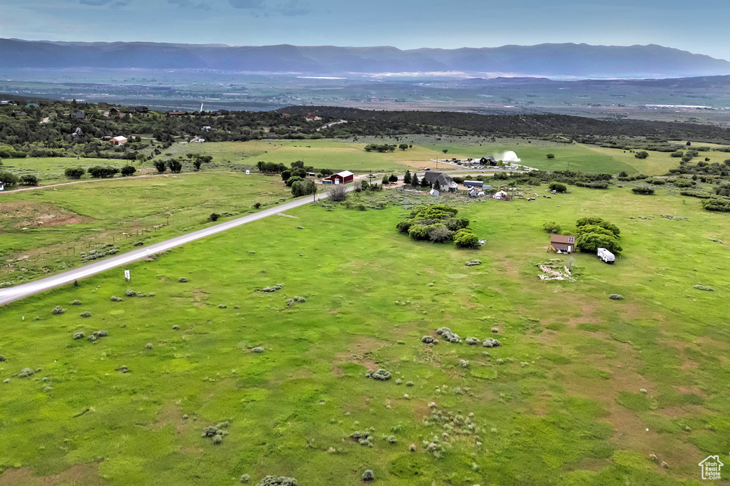 Aerial view of sparsely populated area featuring a mountain backdrop