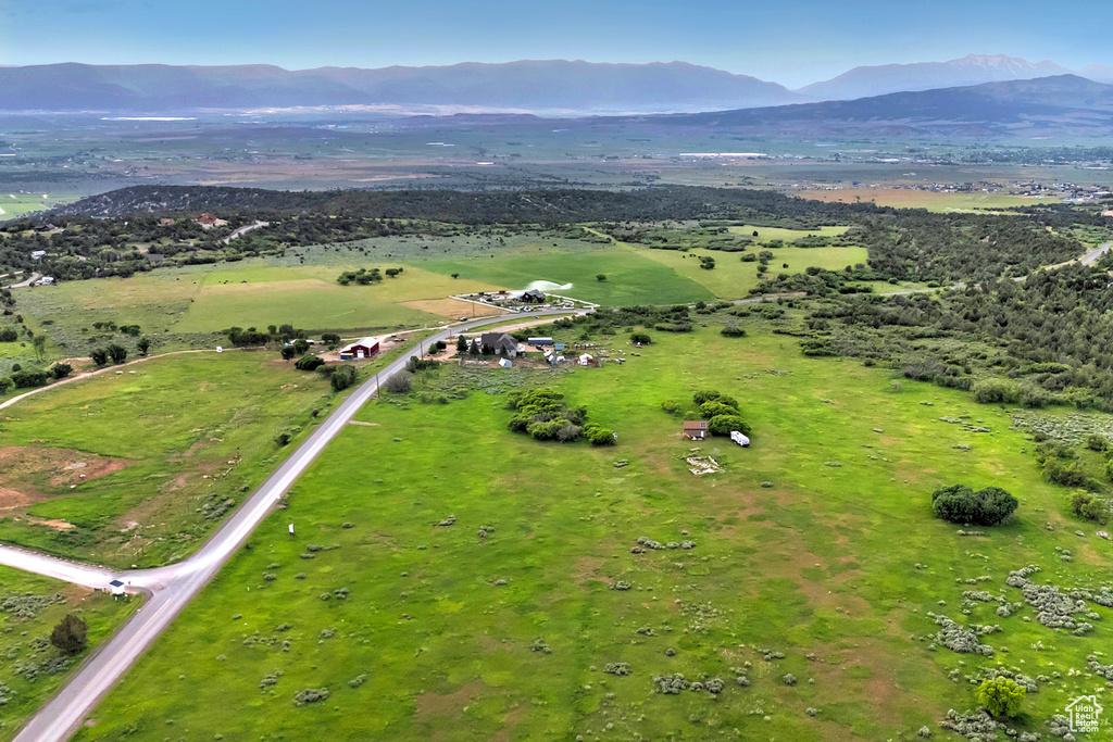 Aerial view of property's location with mountains and rural landscape