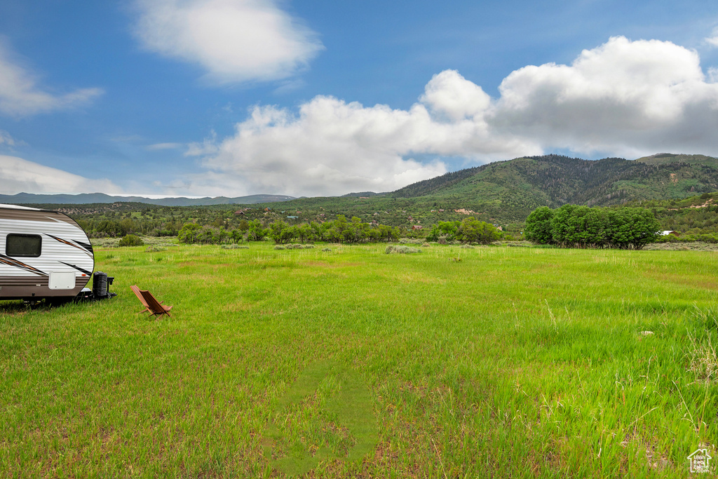 View of mountain backdrop with rural landscape