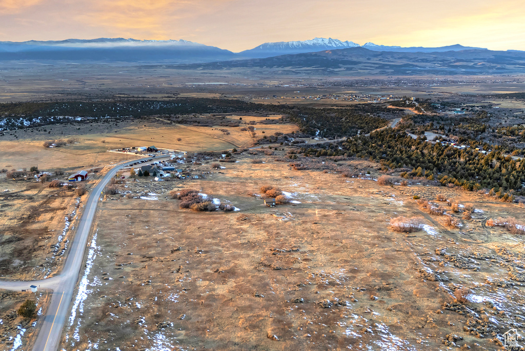 Aerial view at dusk featuring a mountain view