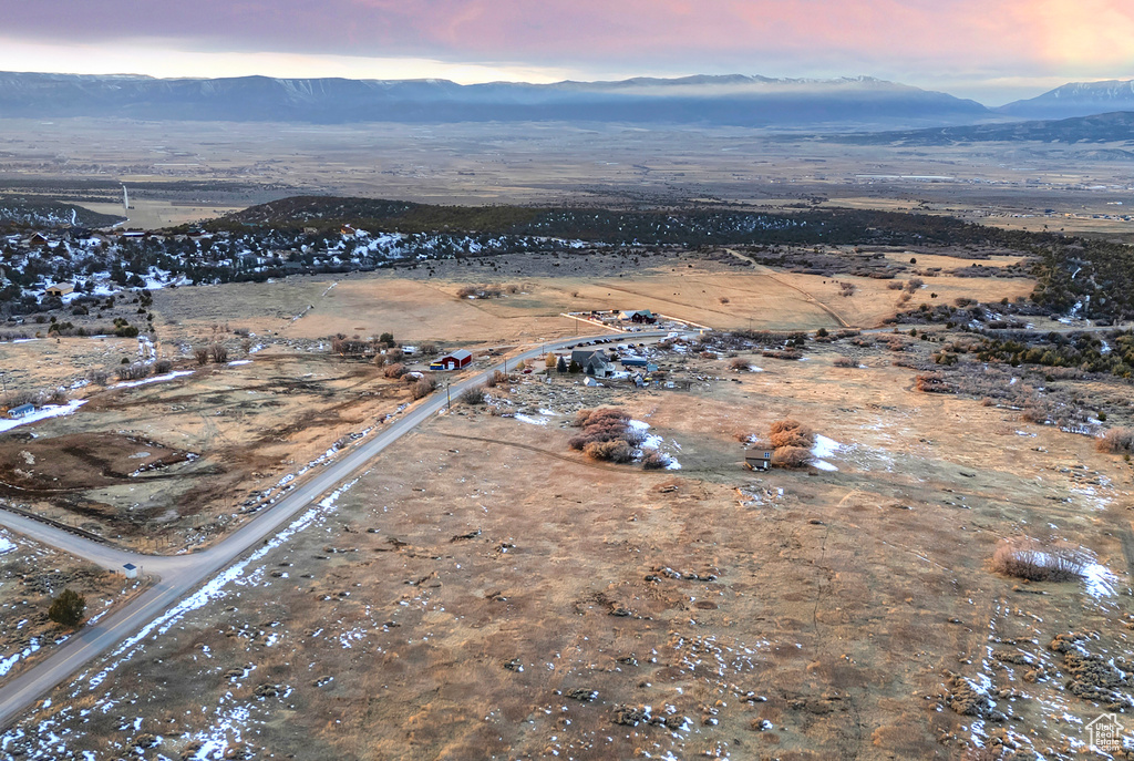 Aerial view at dusk featuring a mountain view