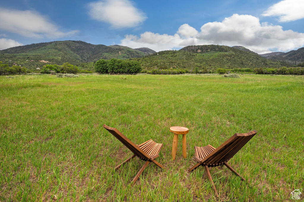 View of mountain background featuring rural landscape