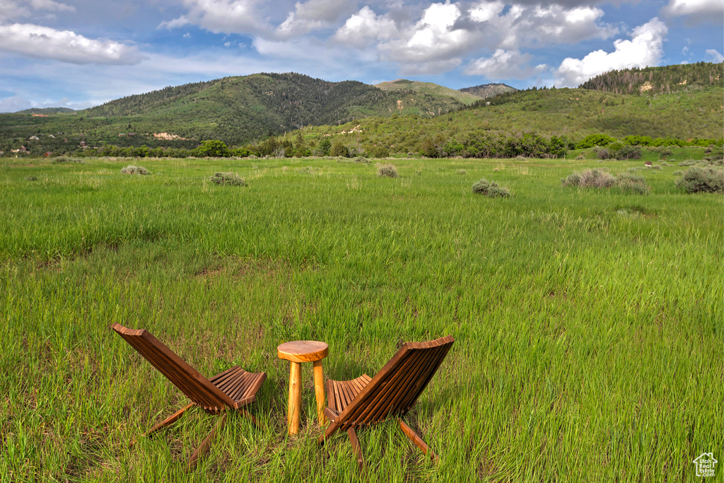 View of mountain background featuring rural landscape