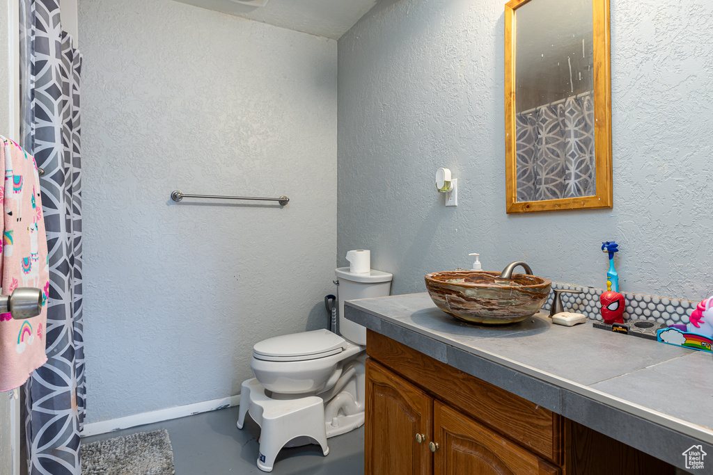 Bathroom with vanity and toilet