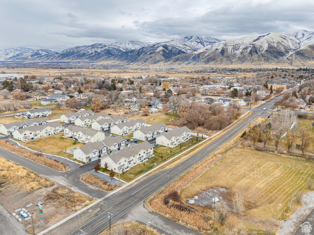 Birds eye view of property with a mountain view