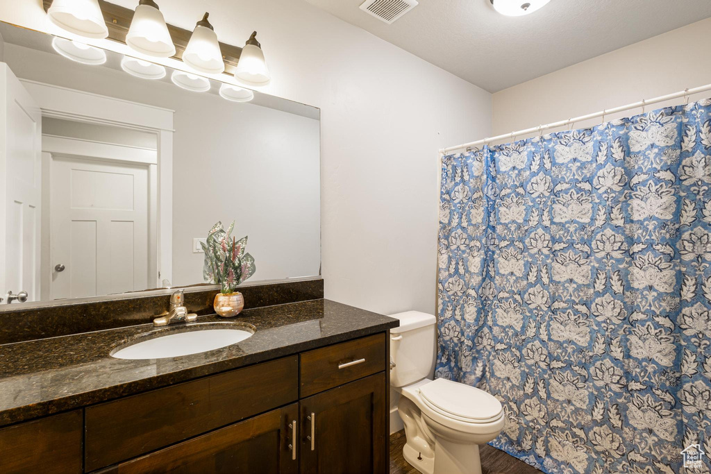 Bathroom with vanity and toilet