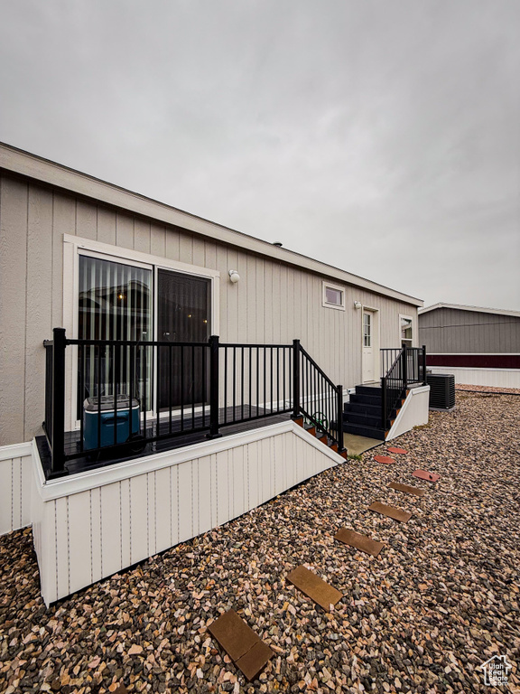 View of side of property with central AC