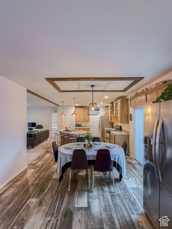 Dining room with wood-type flooring