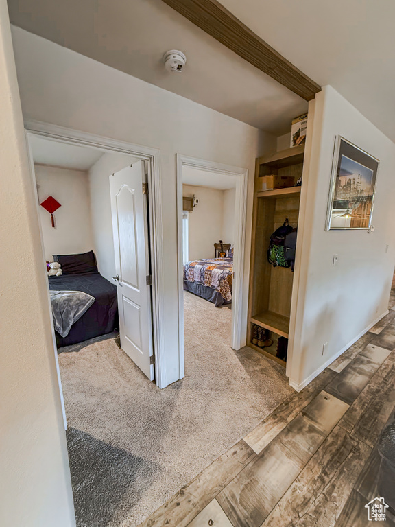 Corridor featuring carpet flooring
