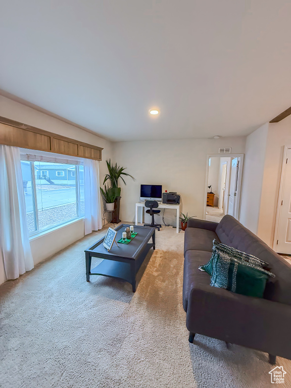 Living room featuring light carpet