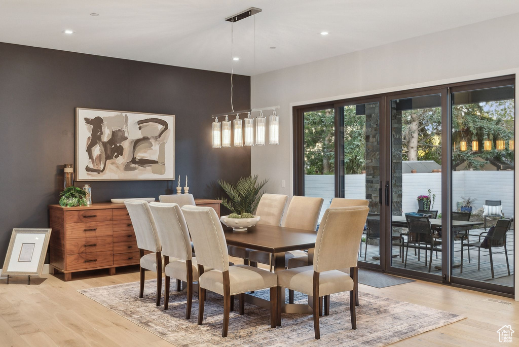Dining space featuring wood finished floors and recessed lighting