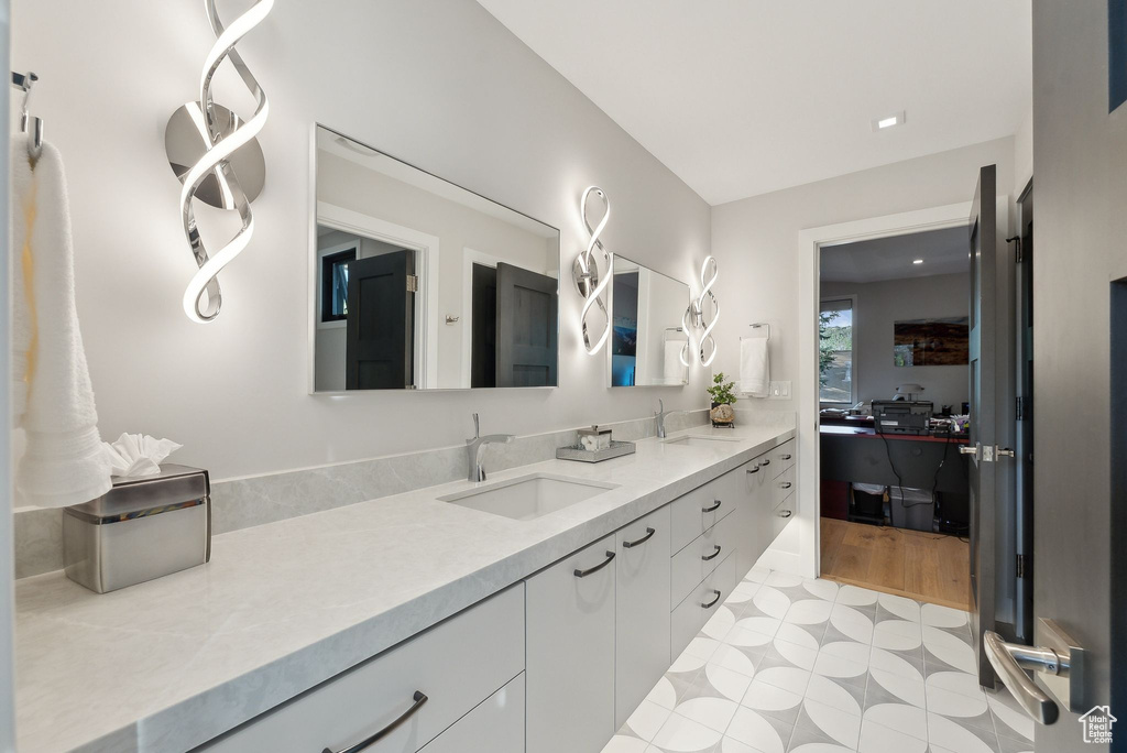 Bathroom with vanity and tile patterned floors
