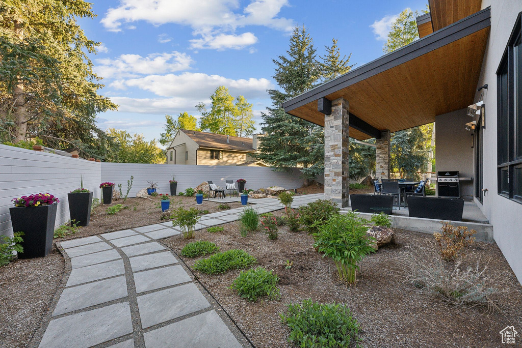 Fenced backyard featuring a patio area