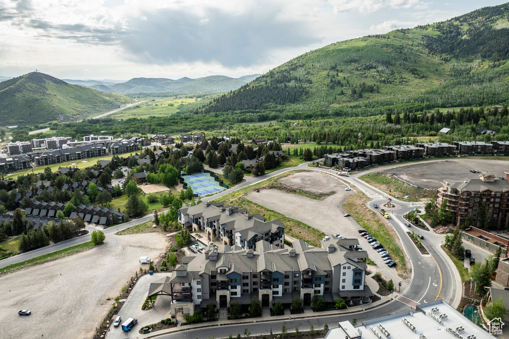 Aerial view of property and surrounding area featuring mountains