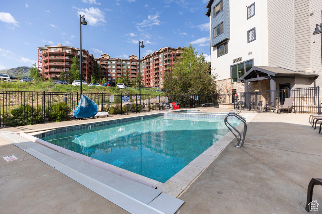 Community pool featuring a patio area