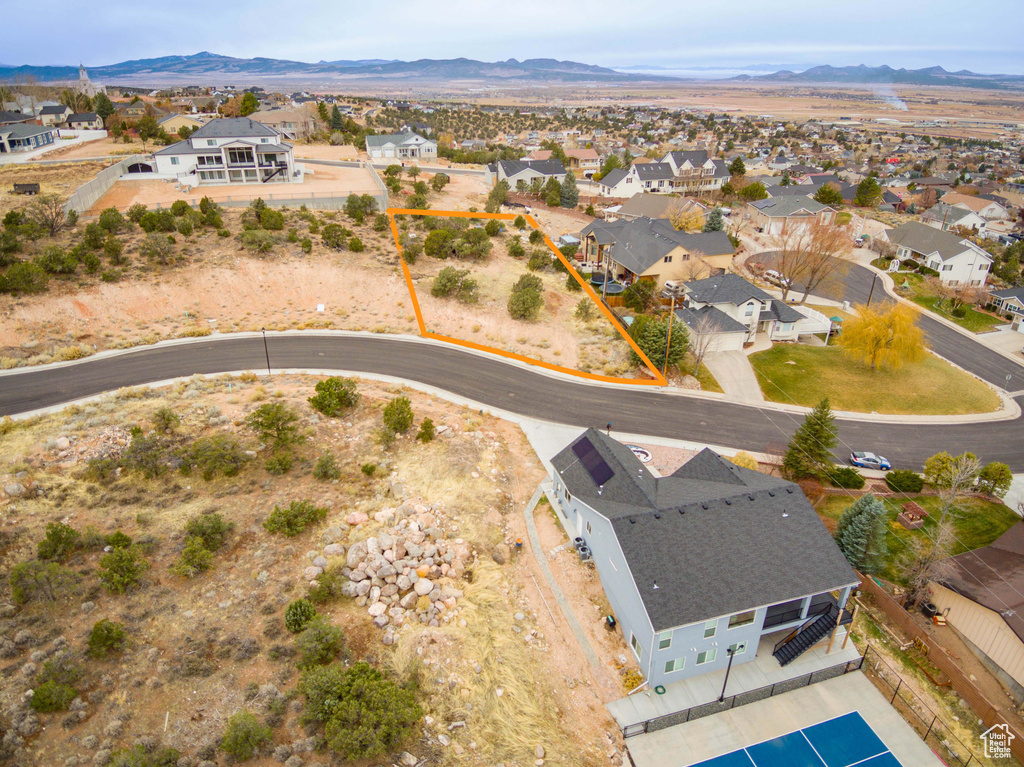 Birds eye view of property featuring a mountain view