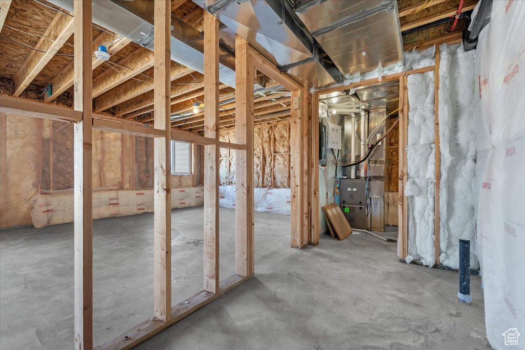 Miscellaneous room with concrete floors and heating unit