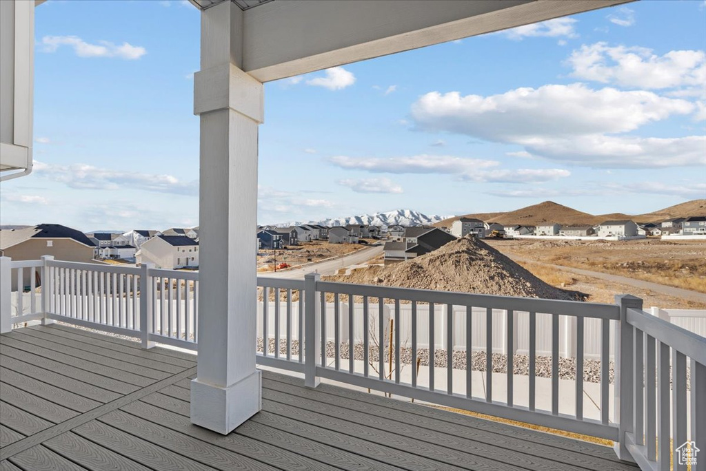 Wooden terrace featuring a residential view