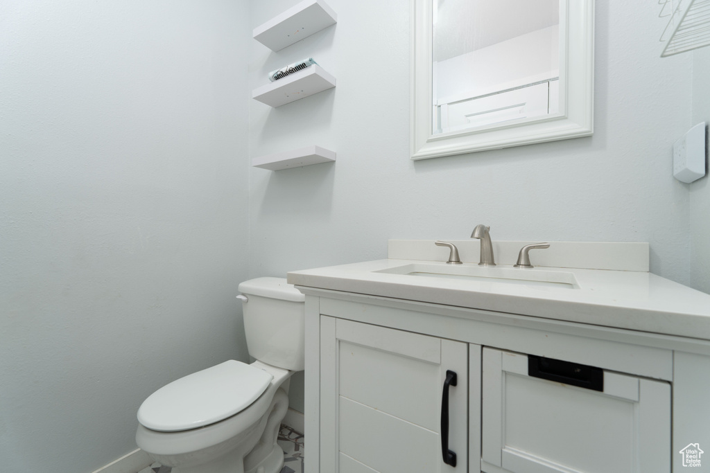 Bathroom featuring vanity and toilet