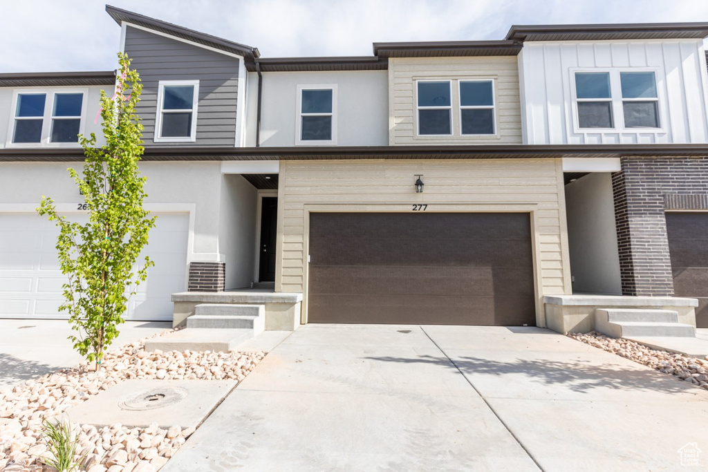 View of property with a garage