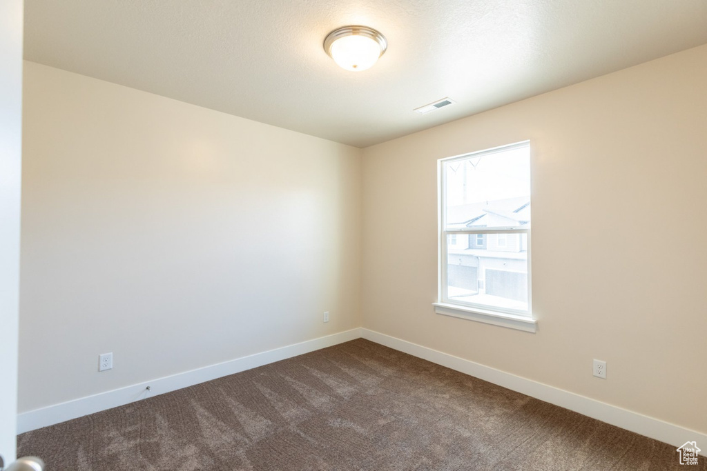 View of carpeted spare room