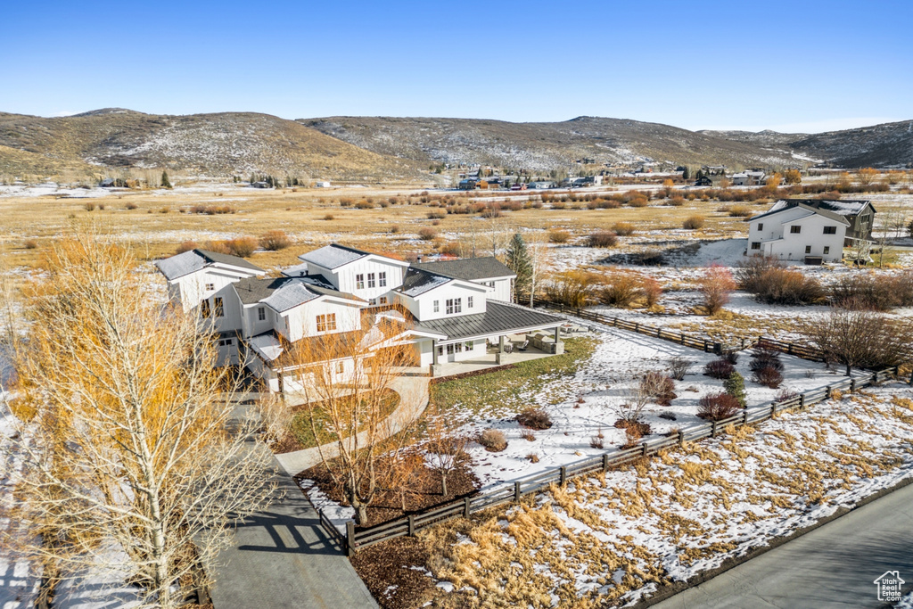 Snowy aerial view featuring a mountain view