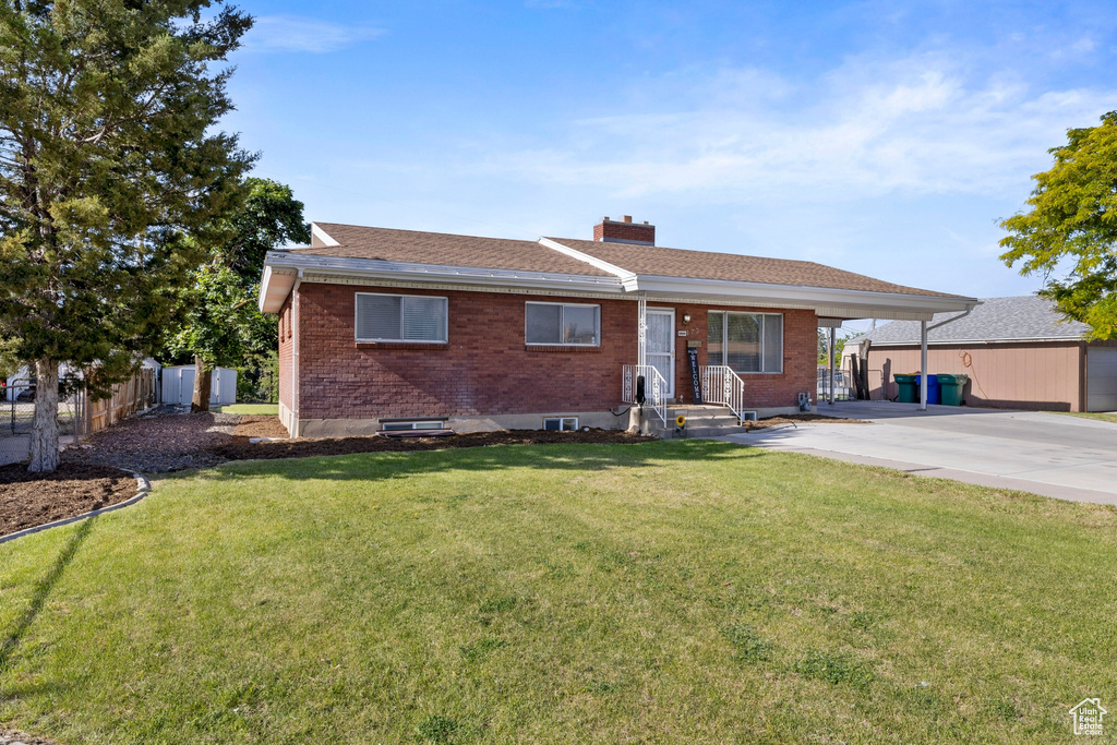 Ranch-style home with a front yard