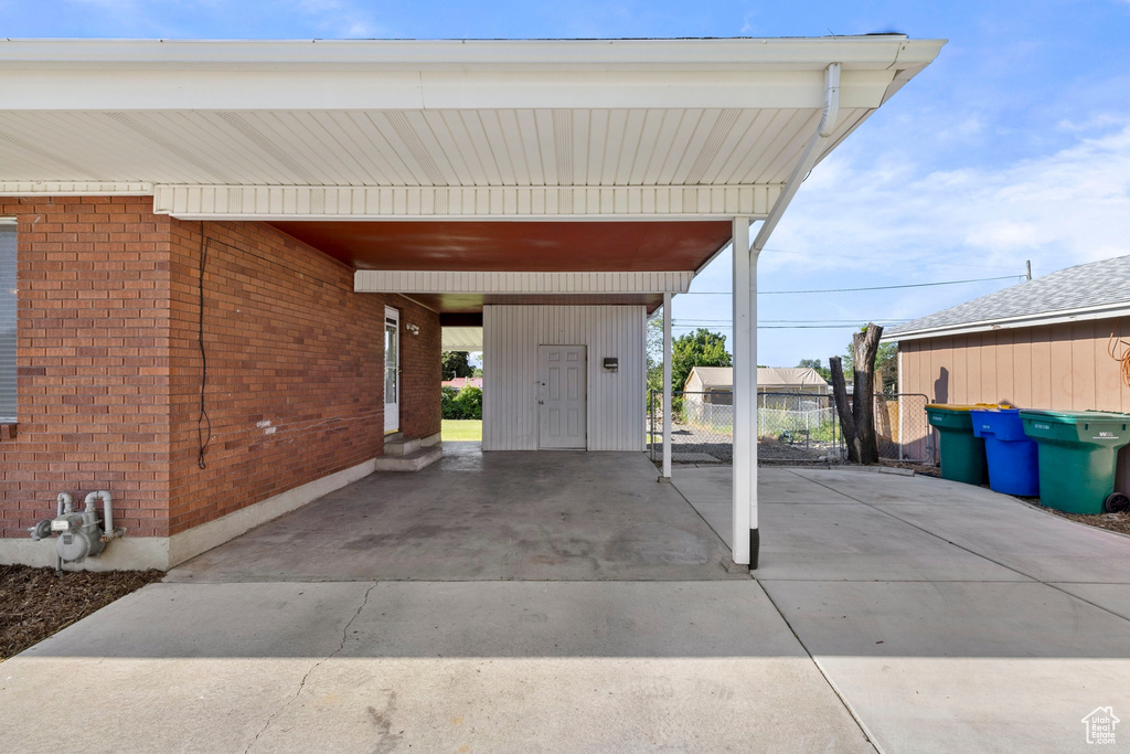 View of patio with a carport