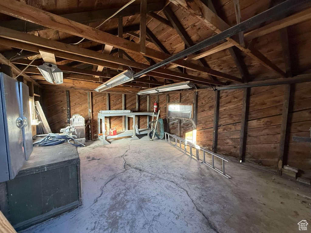 Miscellaneous room with concrete floors and vaulted ceiling