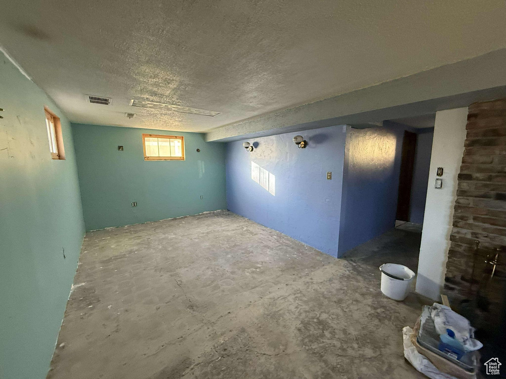 Spare room featuring a textured ceiling