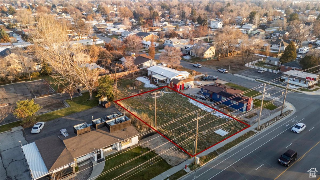 Aerial perspective of suburban area featuring property parcel outlined