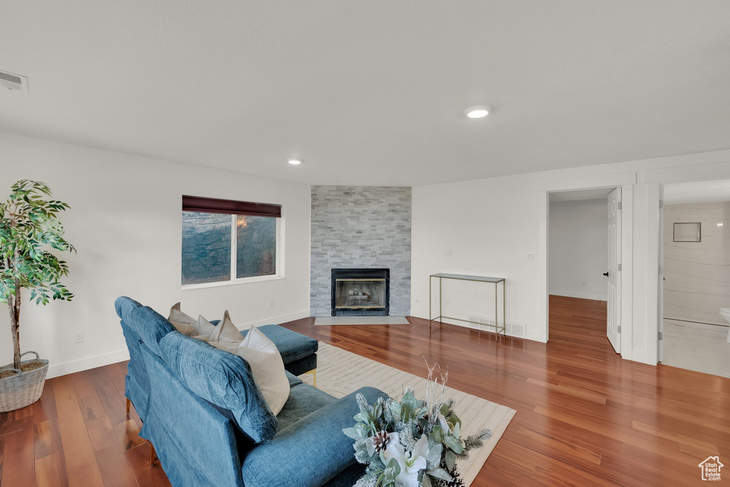 Living room featuring a fireplace and hardwood / wood-style flooring