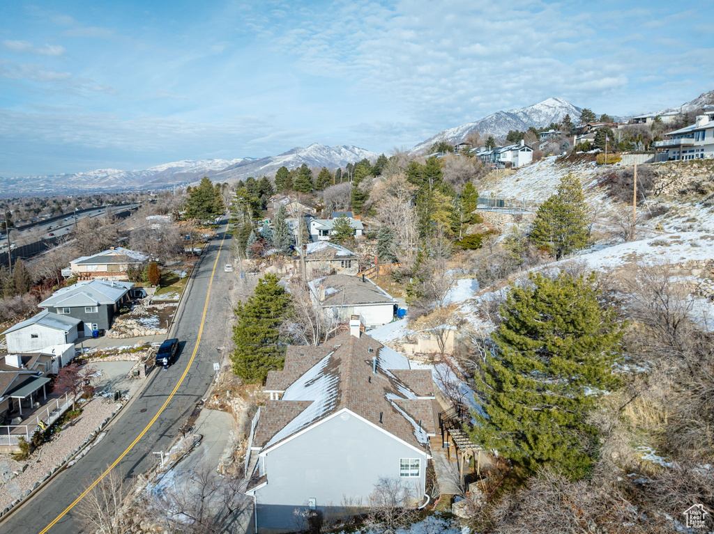 Birds eye view of property with a mountain view