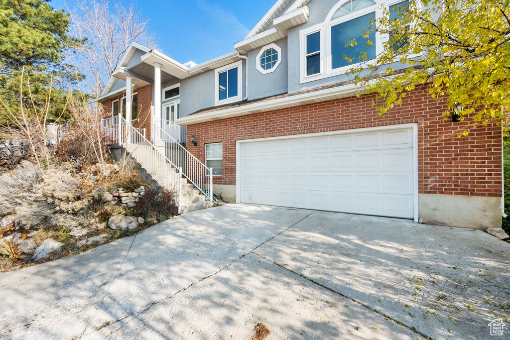 View of front facade featuring a garage