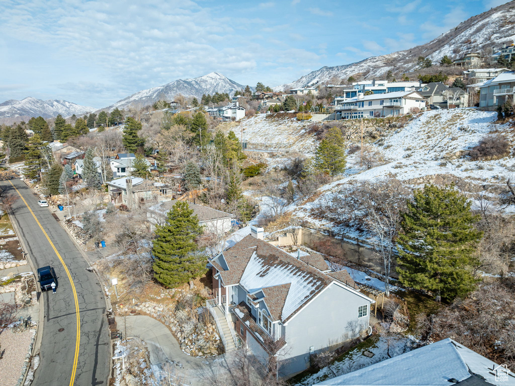 Snowy aerial view featuring a mountain view