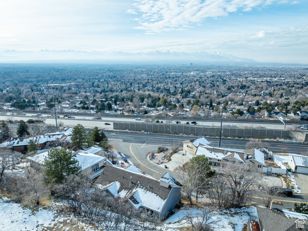 Snowy aerial view featuring a mountain view