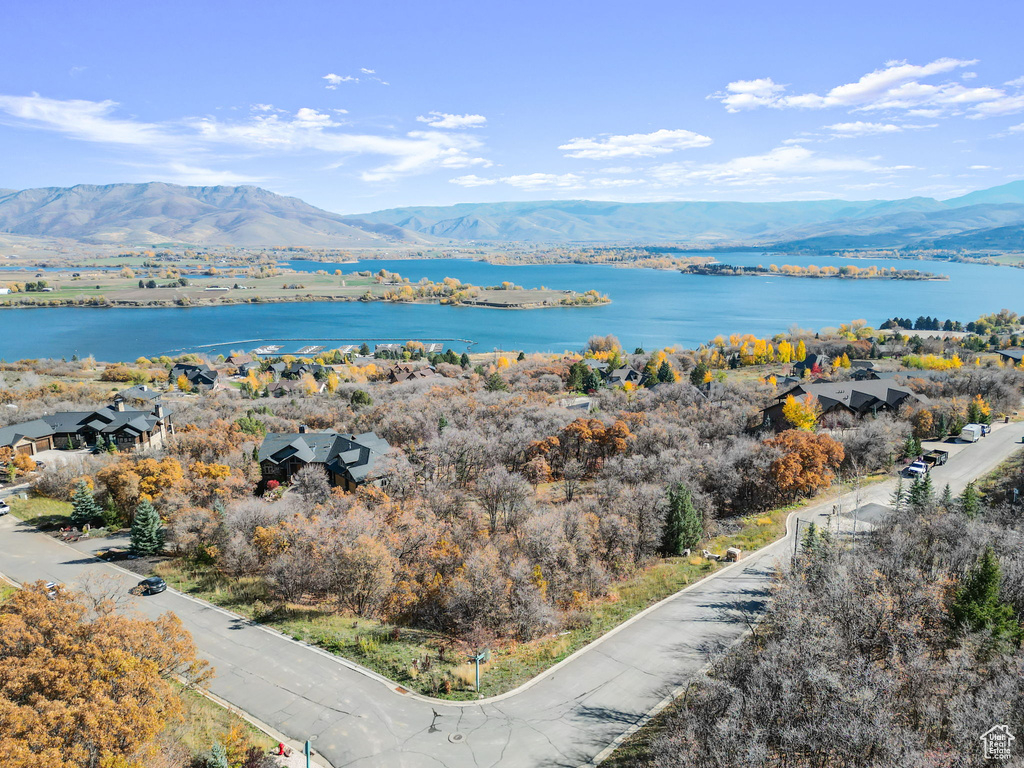 Exterior space featuring a water and mountain view