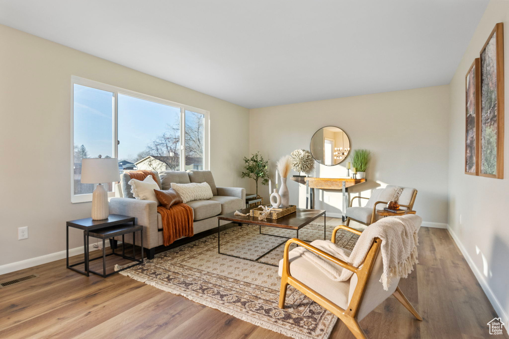 Living room with wood-type flooring