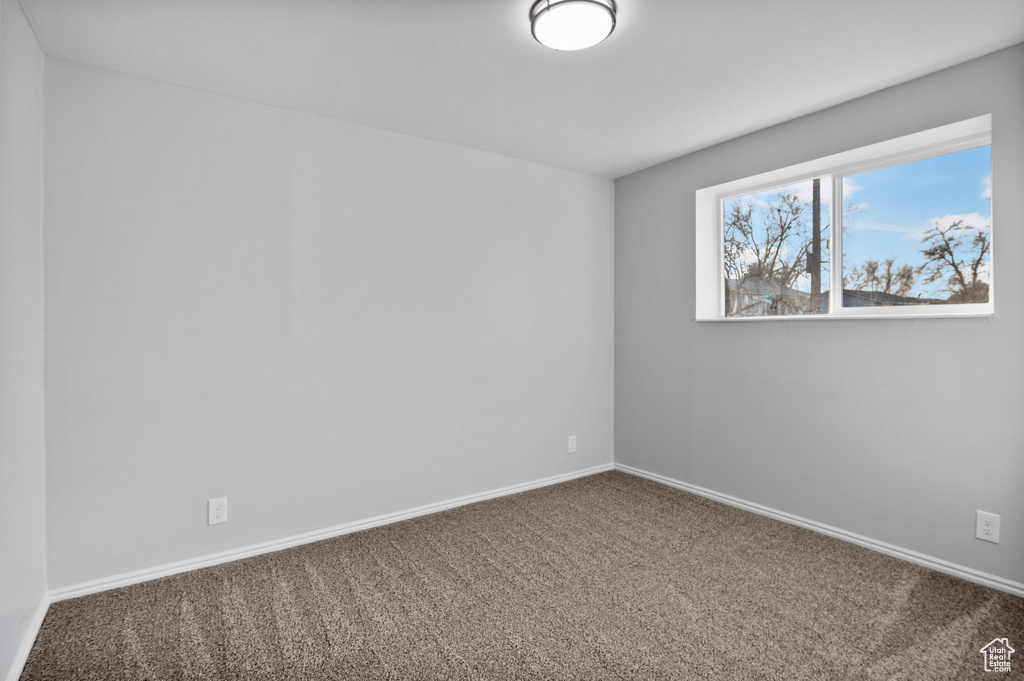 Empty room featuring carpet