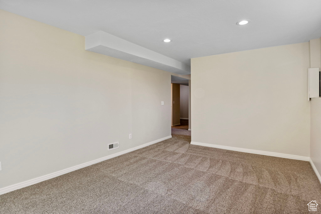 Unfurnished room with carpet flooring